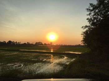 Scenic view of sunset over lake