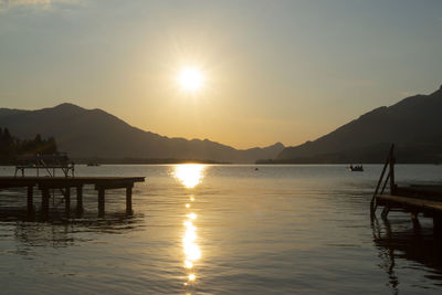 Scenic view of lake at sunset