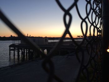 Scenic view of river against sky during sunset