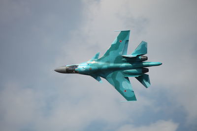 Low angle view of airplane against sky