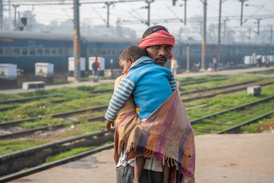 Rear view of couple standing outdoors