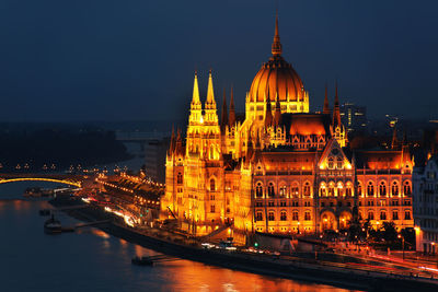 Illuminated buildings in city at night