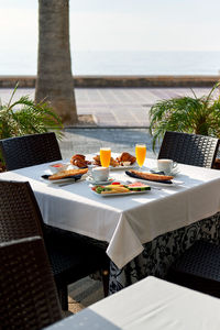 High angle view of food on table by sea