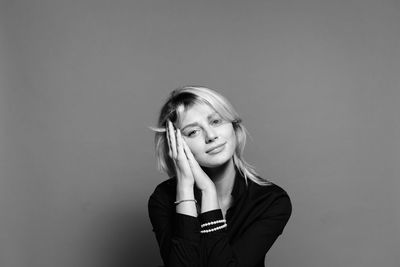 Portrait of a beautiful young woman over white background