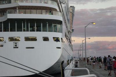 View of boats moored in building against sky