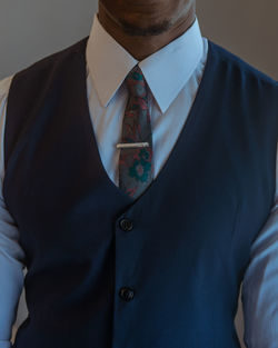 Midsection of man in a tie and waistcoat 