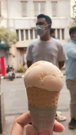 Woman holding ice cream cone