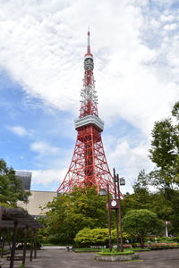 Low angle view of tower and building against sky