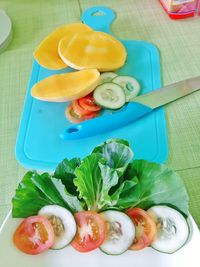 High angle view of fruits in plate on table