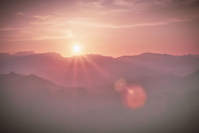Scenic view of mountains against sky during sunset