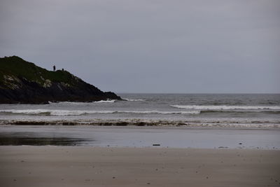 Scenic view of beach and sea against sky