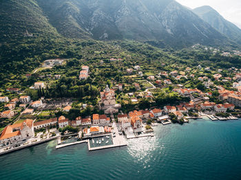 High angle view of townscape by sea