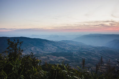 Scenic view of mountains against sky during sunset