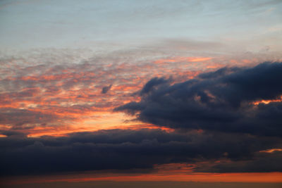 Low angle view of dramatic sky during sunset