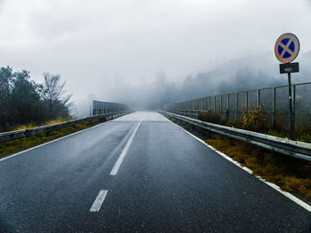 Empty road in foggy weather