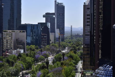 Modern buildings in city against sky