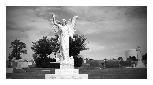 Low angle view of statue against sky