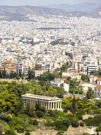 High angle view of cityscape by mountains