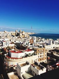 High angle view of townscape against blue sky