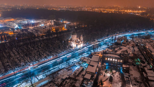 Aerial view of illuminated cityscape at night