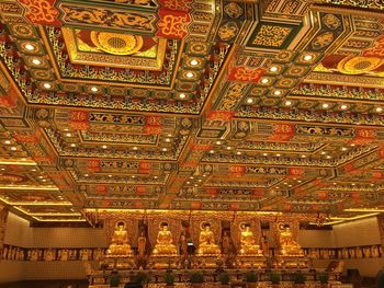 Low angle view of illuminated ceiling