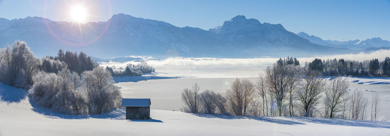 Panoramic landscape with mountain range in snow at winter in bavaria, germany