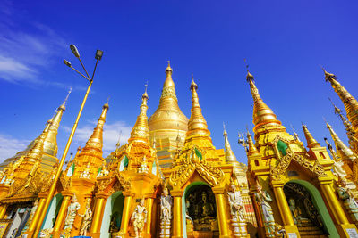 Low angle view of traditional building against blue sky