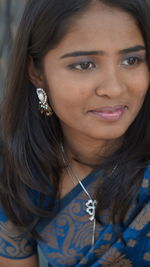 Close-up portrait of a smiling young woman