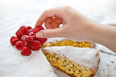 Close-up of hand holding ice cream