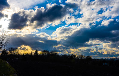 Scenic view of landscape against cloudy sky