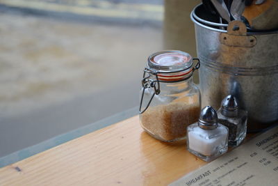 High angle view of jars on table