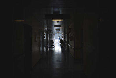 Man standing in corridor at hospital