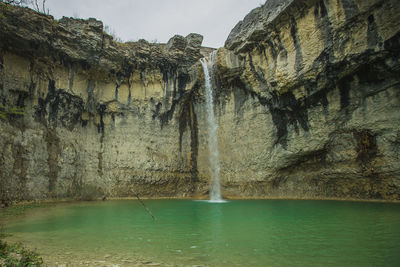 View of rock formations in sea