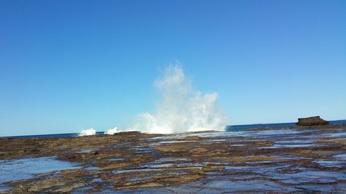 Waves splashing on rocks