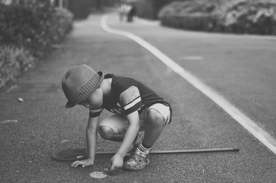 Boy playing on road