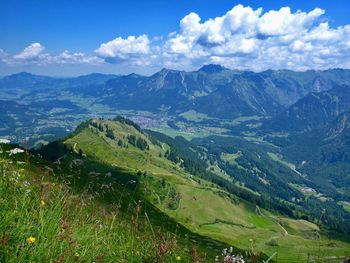 Scenic view of landscape and mountains against sky