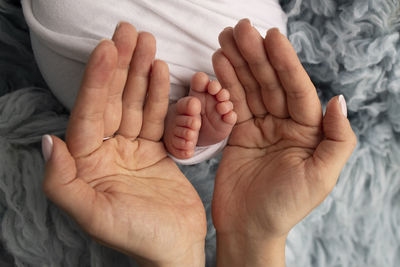 Cropped hand of person holding hands