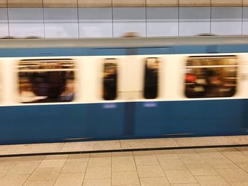 Blurred motion of train at railroad station