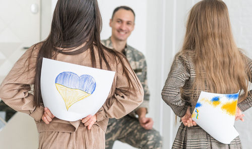 Daughters surprising father at home