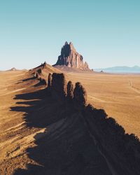 Scenic view of desert against clear sky