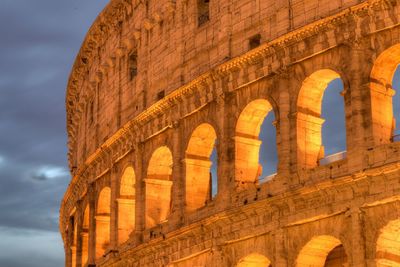 Low angle view of coliseum against sky