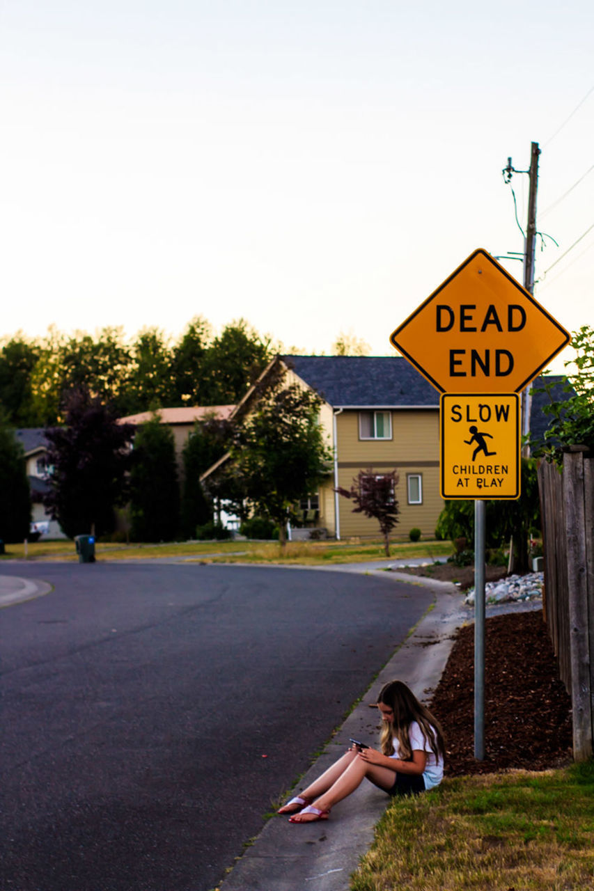 ROAD SIGN AGAINST SKY