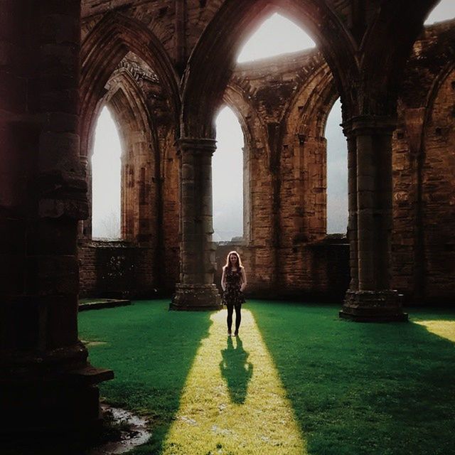 architecture, arch, full length, built structure, lifestyles, indoors, history, men, walking, leisure activity, person, rear view, architectural column, old ruin, archway, building exterior, standing, the past