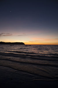 Scenic view of sea at sunset