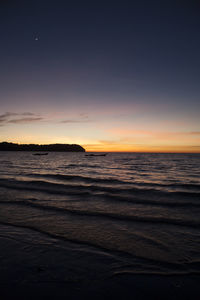 Scenic view of sea at sunset