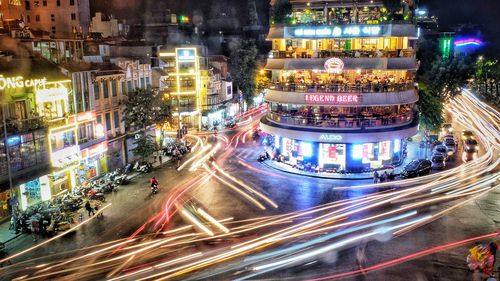 High angle view of light trails on city street at night