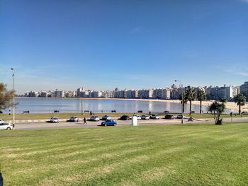 Scenic view of river against clear blue sky