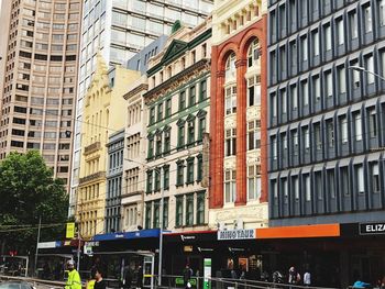 Buildings by street in city