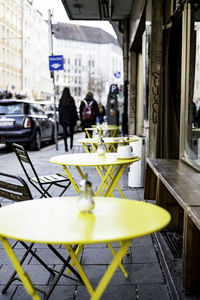 Tables and chairs arranging at sidewalk cafe