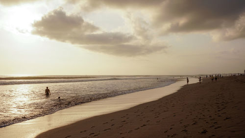 Scenic view of beach against sky during sunset